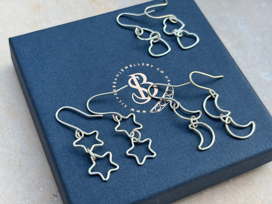 Silver star drop earrings