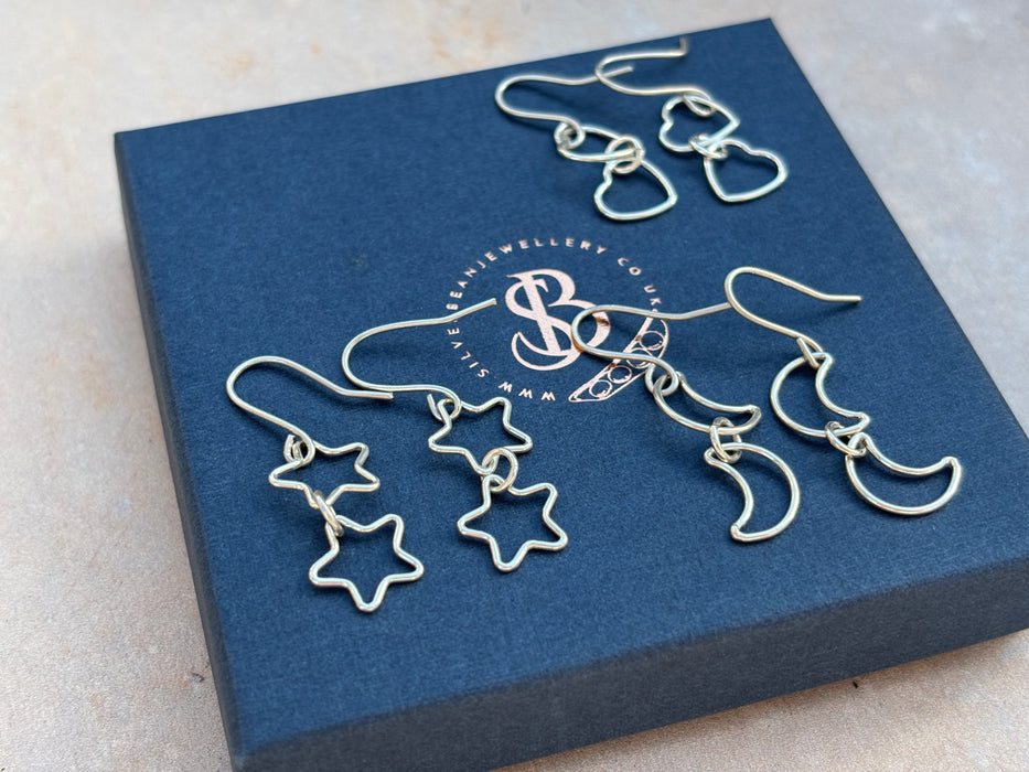 Silver star drop earrings