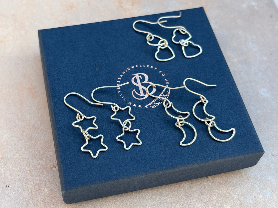 Silver star drop earrings