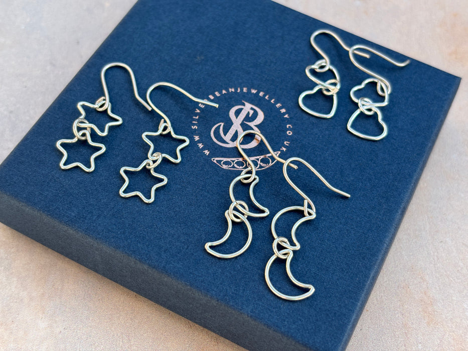 Silver star drop earrings
