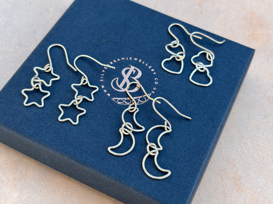 Silver star drop earrings