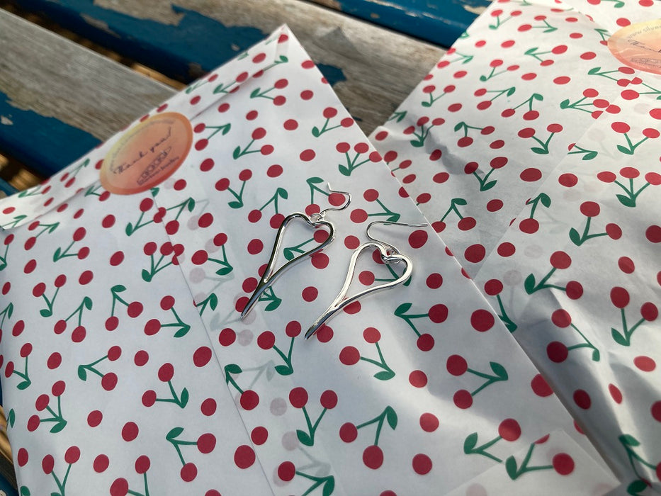 Asymmetric heart earrings