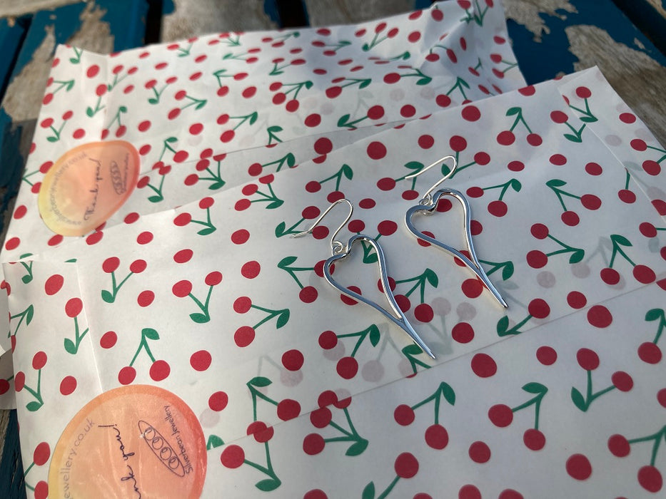 Asymmetric heart earrings