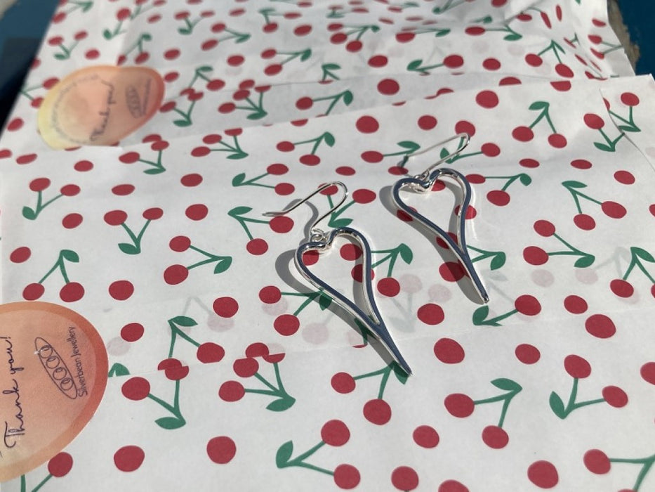 Asymmetric heart earrings