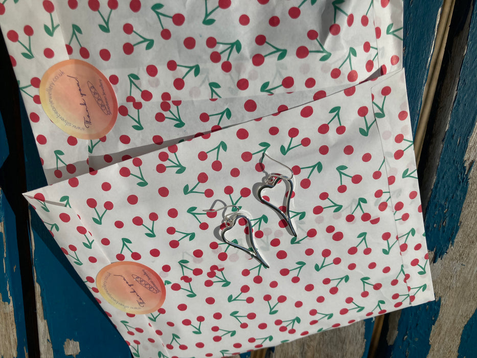 Asymmetric heart earrings