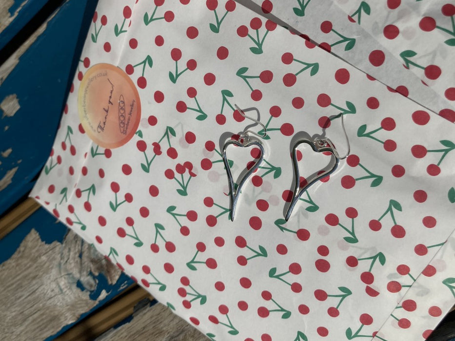 Asymmetric heart earrings