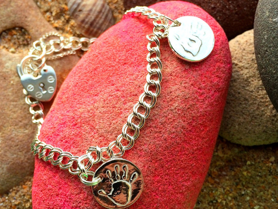 Silver handprint charm bracelet with padlock