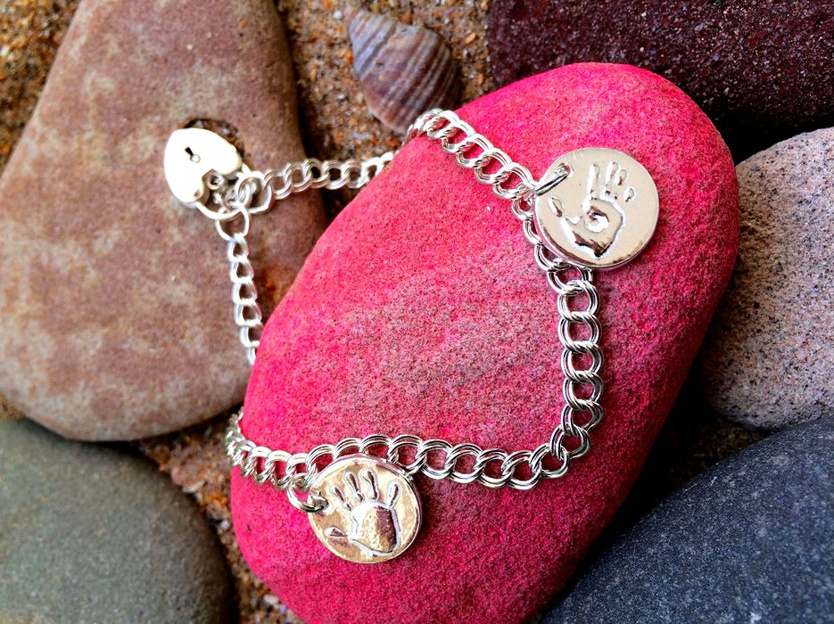 Silver handprint charm bracelet with padlock