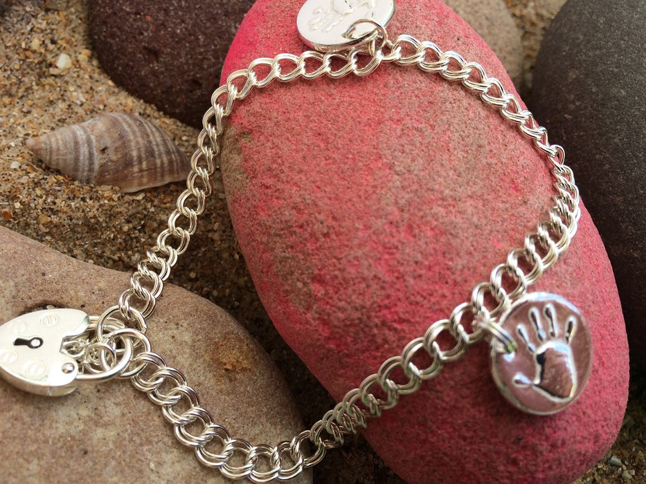 Silver handprint charm bracelet with padlock