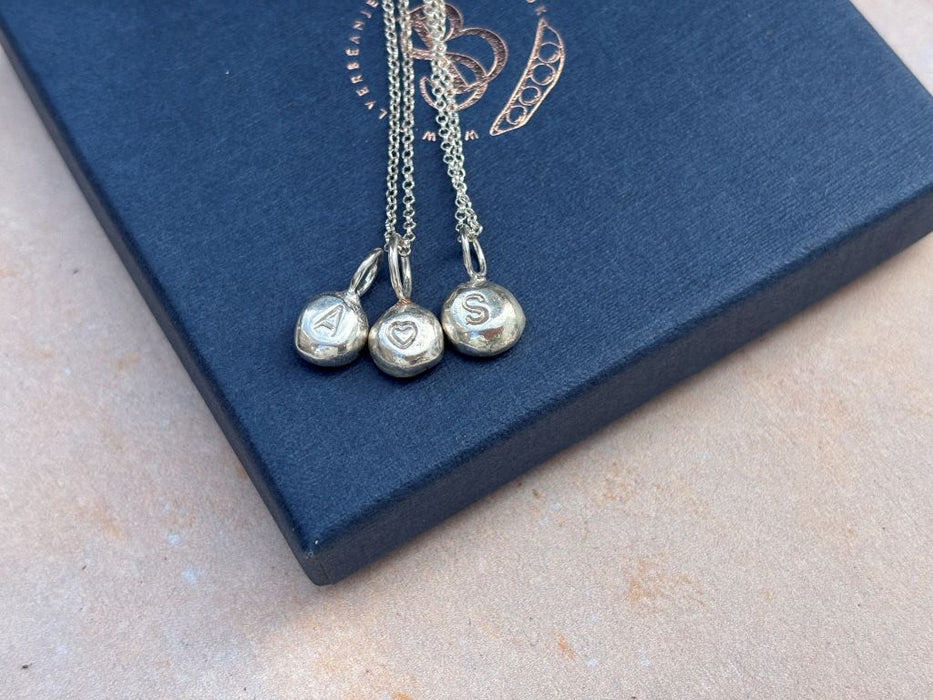 Silver strength nugget necklace